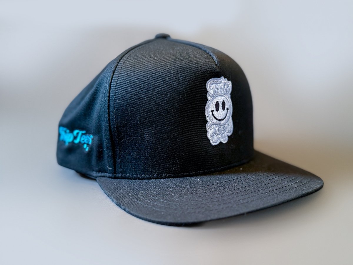 White Logo Black Eyes Snapback Hat graphic T-shirt – Festival clothing by Triptees